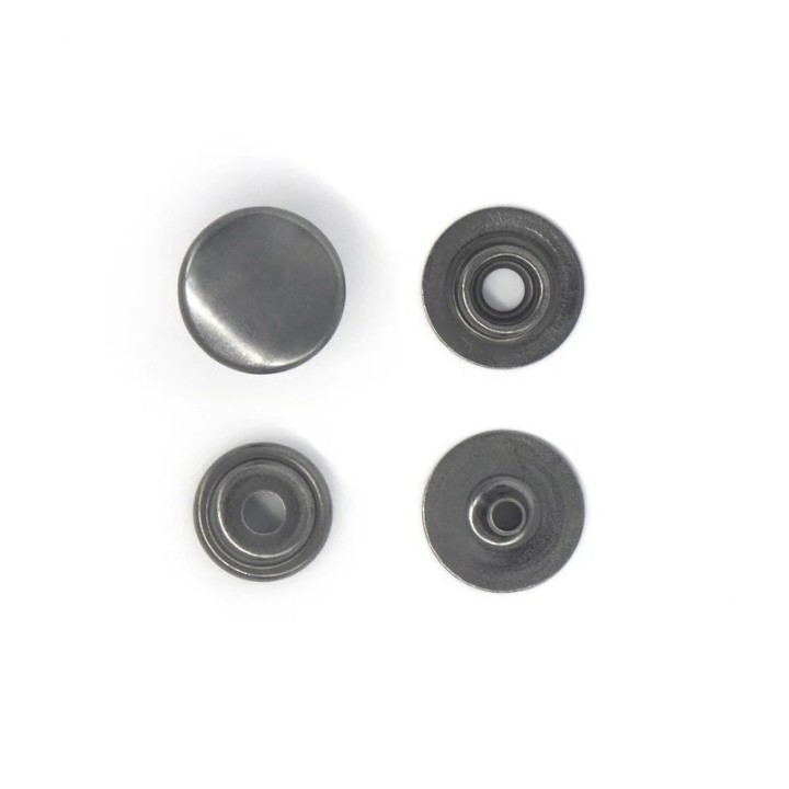 Les 4 pièces composant le bouton pression finition noire pour assemblage sur cuir