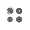 Les 4 pièces composant le bouton pression finition noire pour assemblage sur cuir