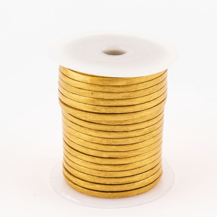 Bobine 25 mètres de lacet de cuir plat 3 mm couleur or métalisé